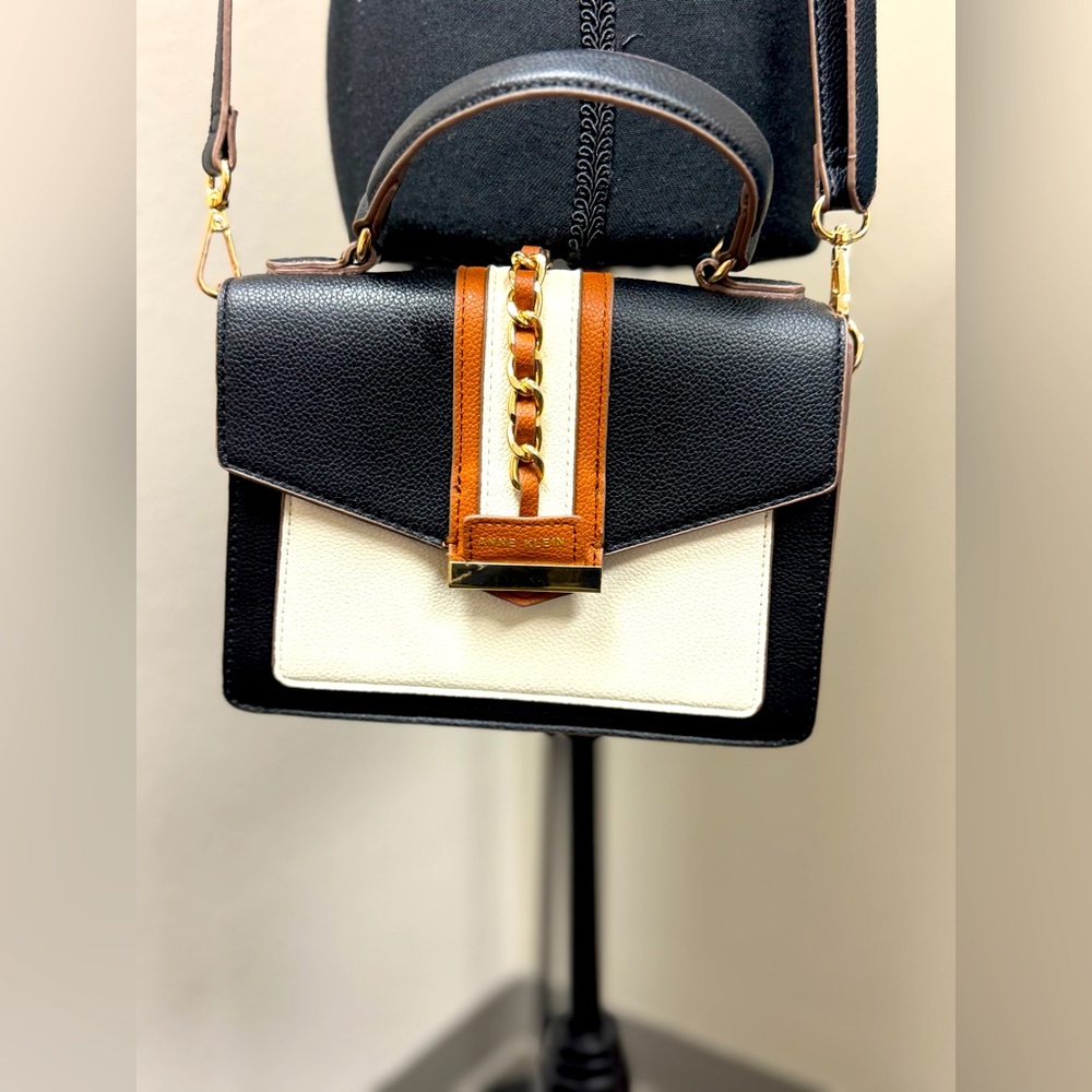 Elegant Black and White Handbag with Brown Accents